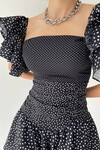 Flounced dress with polka dot pattern
